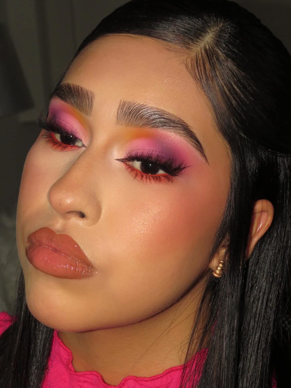 Pink and purple sunset eyeshadow with orange lower liner and glossy nude lips